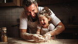 Fototapeta  - dad and daughter making dough in the kitchen laughing