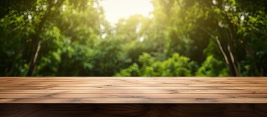 Leinwandbilder - A wooden table with a blank surface is placed against a blurry natural background. This space can be