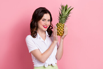 Sticker - Photo of sweet adorable lady wear white blouse smiling rising ripe pineapple isolated pink color background