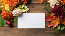 Autumn Fall Paper Card Empty Mockup Flatlay Maple Leaves Poster On A Wooden Rustic Table Decorated With Herbal Flowers Harvesting Thanksgiving Day Celebration. 