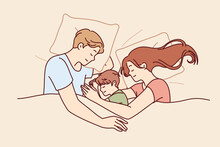 Happy Family Couple With Child Sleeps In Bed And Smiles Enjoying Healthy Sleep And Restoring Strength After Hard Day Work. Family Of Man And Woman Hugging Sleeping Son Lying Under Blanket