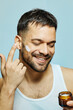 portrait beauty hygiene man care morning skin cosmetic cream moisturizer cosmetology facial applying hygiene moisturizing guy routine male body