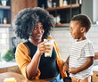 © Lumos sp - child family kitchen boy son mother father drink breakfast milk healthy drinking food eating glass home black african american father man together love cute childhood