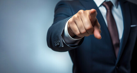 business man points his finger at youю Businessman pointing with finger with copy space


