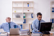 © Elnur - Two male colleagues working in the office