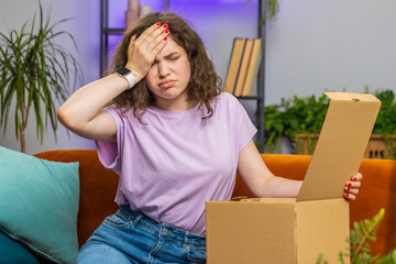 angry dissatisfied shopper young woman unpacking parcel feeling upset and confused with the wrong de