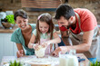 © ivanko80 - Young family with little daughter have fun in kitchen