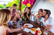 © ivanko80 - Group of friends drinking beer and eating pizza