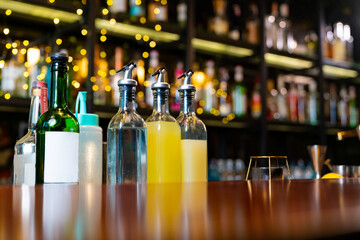 Poster - Professional Asian man bartender preparing and serving cocktail drink to customer on bar counter at nightclub. Barman making mixed alcoholic drink for celebrating holiday party at restaurant bar.