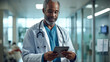 © redflower - A doctor is attending to a patient while holding a tablet. A doctor using a tablet for a physician consulting patient's health online using an internet mobile digital tablet in a clinic or hospital