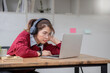 © wichayada - Stress, student with laptop at home frustrated angry unhappy young woman looking at laptop screen book, Exhausted female student studying online with computer