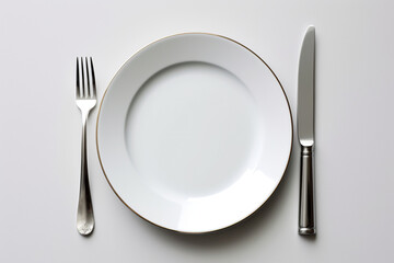 plate with fork and knife on white background