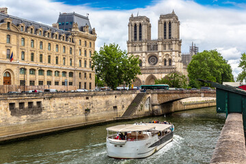 Poster - River cruise boat and Notre Dame de Paris in a summer day, France