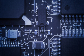 Wall Mural - Closeup of Printed Circuit Board with processor, integrated circuits and many other surface mounted passive electrical components.