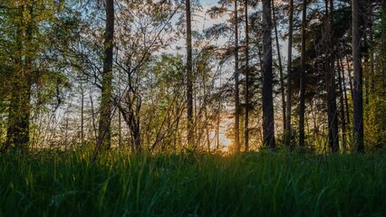 Wall Mural - 4k time lapse of majestic sunset or sunrise landscape, amazing light of nature cloudscape sky and cl
