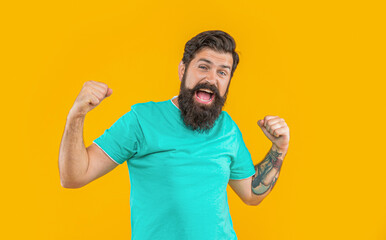Wall Mural - portrait of shouting brutal man with beard. portrait of brutal man with beard isolated on yellow