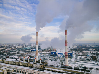 Wall Mural - Industrial factory smokestack emission smoke from natural gas in atmosphere. Industry zone, factory smoke plumes. Global energy crisis