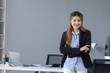Happy smiling young asian woman standing at desk in office, Happy secretary Asian business woman, Smart business woman,