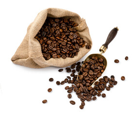 Wall Mural - Scoop of coffee beans and a bag with coffee beans isolated. Coffee in scoop. Top view of coffee.