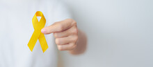 Yellow September, Suicide Prevention Day, Childhood, Sarcoma, Bone And Bladder Cancer Awareness Month, Yellow Ribbon For Supporting People Life And Illness. Healthcare And World Cancer Day Concept