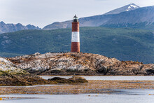 View Of Les Eclaireurs Lighthouse With Cormorants And Sea Lions On The Rocks, A Famous Landmark On Beagle Channel Near Ushuaia, Tierra Del Fuego, Patagonia, Argentina.