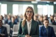 © Banana Images - Happy business woman Giving a speech with confidence and charisma, women in business working office