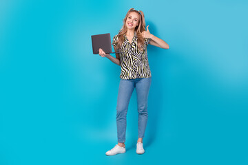 Poster - Full length photo of satisfied girl dressed striped blouse showing thumb up nice work hold laptop isolated on blue color background