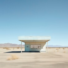 An Abandoned White Colored Store In The Desert 