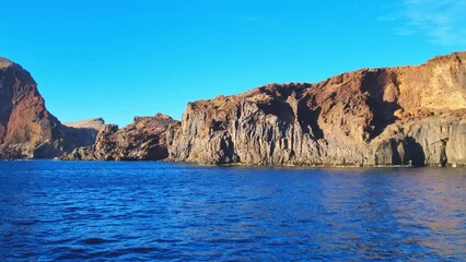 Wall Mural - Beautiful view of the cliffs of the island in the Atlantic Ocean from a boat