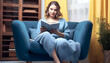 © wiizii - woman sitting on Blue sofa and book