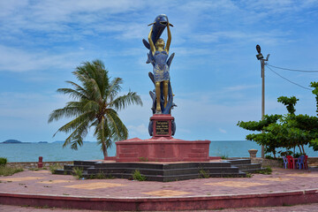 Statue of a lady and a fish in Kep, Cambodia