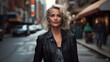Portrait of an attractive mature woman wearing a leather jacket in the city