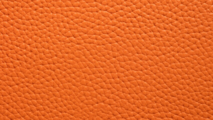 Texture of orange natural or artificial leather closeup background