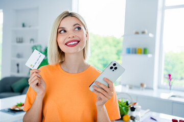 Sticker - Photo of positive dreamy girl shopping online transfer money pay with credit card gadget device in dining room