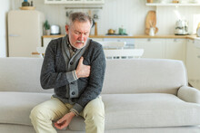 Pain On Heart, Heart Attack. Unhappy Middle Aged Senior Man Suffering From Chest Pain Heart Attack Problems With Health At Home. Mature Old Senior Grandfather Touching Chest Experiencing Infarction