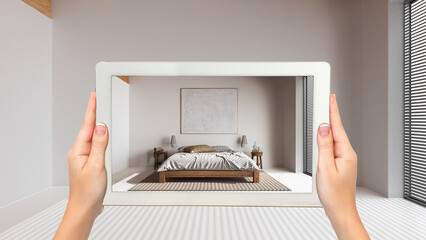 Wall Mural - augmented reality concept. hand holding tablet with ar application used to simulate furniture and de