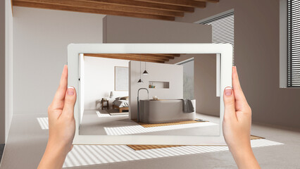 Wall Mural - augmented reality concept. hand holding tablet with ar application used to simulate furniture and de