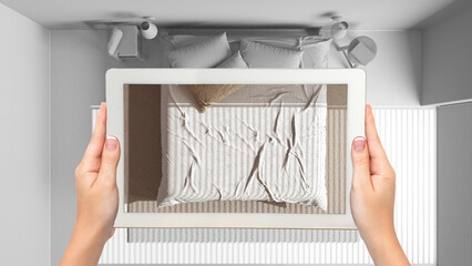 Wall Mural - augmented reality concept. hand holding tablet with ar application used to simulate furniture and de