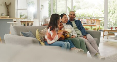 Canvas Print - Sofa, children and popcorn with a family watching tv together for entertainment in the living room of their home. Kids, parents and streaming a subscription service with a group of people in a house