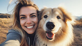 Fototapeta  - Happy woman and dog taking selfie outdoors - Owner having enjoying sunny day with its dog playing together outside - Animals and human love