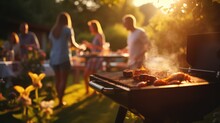 A Group Of People At A Barbecue At Sunset. Summer Vacation. Grilled Vegetables. Dinner On The Grill. Tasty Juicy Meat Cooked On The Grill. Holiday