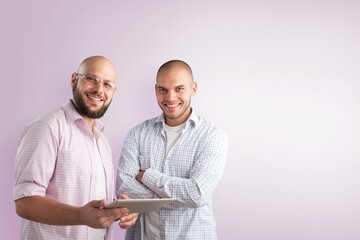 Poster - Business partners looking at camera, posing and smiling.