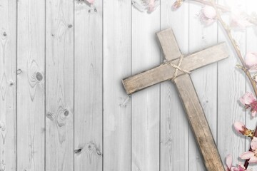 Wall Mural - Christian wooden cross with fresh flower branches blossoms