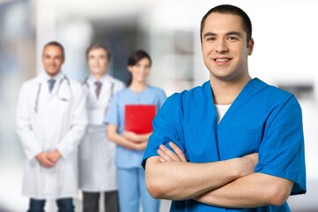 Wall Mural - Portrait of smiling medical nurse looking at camera.