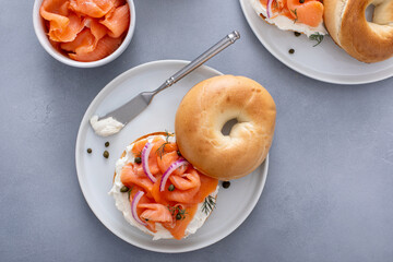 Wall Mural - Plain bagel with salmon and cream cheese with fresh dill and capers