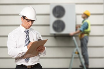 Technician, inspection work and repair with clipboard