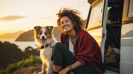 Wall Mural - teenage asian woman with smilling .she's travelling with sheepdog,  Van house travel car. enjoying the view. capping with dog, mountain and lake view background.
