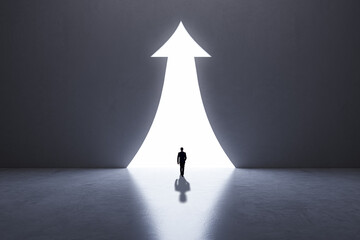 Poster - Back view of businessperson silhouette in abstract concrete interior with upward arrow opening. Success, financial growth and future concept.