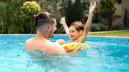 Wall Mural - Dad and son in the pool