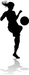 Canvas Print - A female soccer football player woman in silhouettes